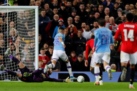 Manchester City’s Riyad Mahrez scores his team’s second goal.