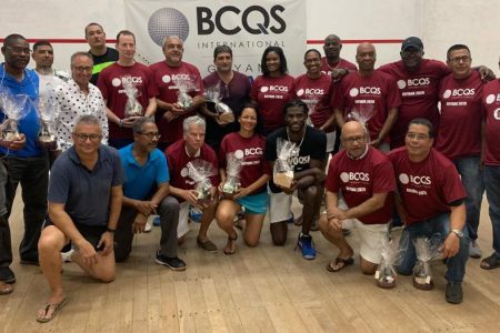 Participants of the inaugural BCQS International Masters Squash tournament display their spoils.
