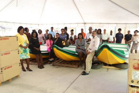 Minister of Public Health, Volda Lawrence and Director of Regional and Clinical Services, Dr. Kay Shako showcasing three of the boats with staff of the Public Health Ministry. (DPI photo)