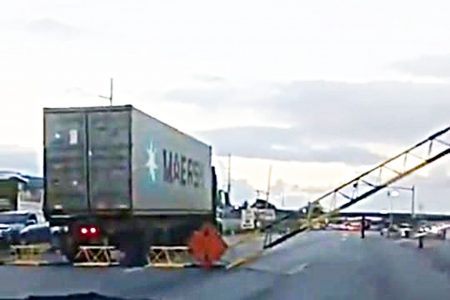 The truck that came into contact with the overhead temporary gantry at the Curepe Interchange, yesterday.