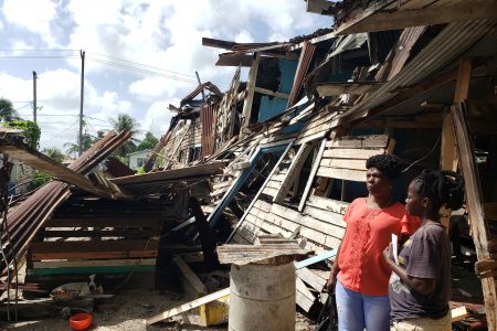 Wanda La Rose in front of the collapsed building where her cousin resided