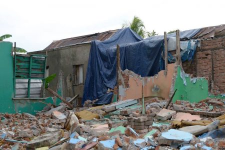 This tarpaulin and these broken walls make up Richardson’s home for the moment.
