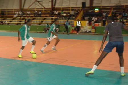 Part of the group stage encounter between Leopold Street and Melanie at the National Gymnasium in the third Magnum Tonic Wine Mashramani Cup Futsal Tournament.  