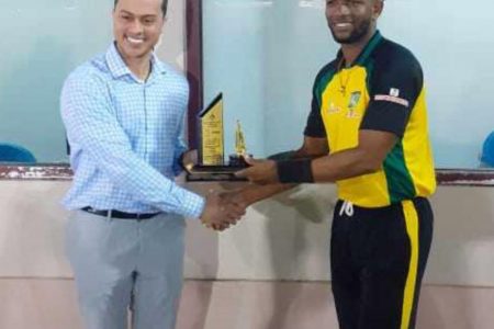  Raj Nannan collects his man of the match prize 
