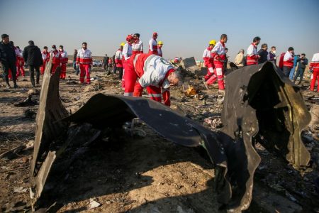  Red Crescent workers check the debris from the Ukraine International Airlines plane, that crashed after take-off from Iran's Imam Khomeini airport, on the outskirts of Tehran, Iran January 8, 2020. Nazanin Tabatabaee/WANA (West Asia News Agency) via REUTERS