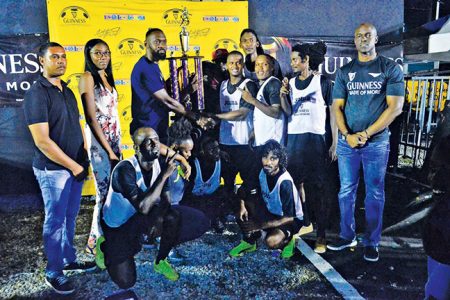 Flashback- Champs once again-!Sparta Boss captain Sheldon Shepherd receives the championship trophy after they defeated Melanie-B in the final of the Guinness ‘Greatest of the Streets’ National Championships in the presence of teammates and Guinness Brand Manager Lee Baptiste
