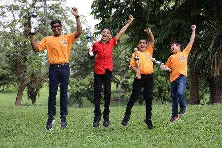 From left, Teevan Samlal, Ivan Maharaj, Bruce Boodoo and Kristoff Seebaran celebrate after placing in the top three at the UCMAS International competition in Cambodia on December 8.