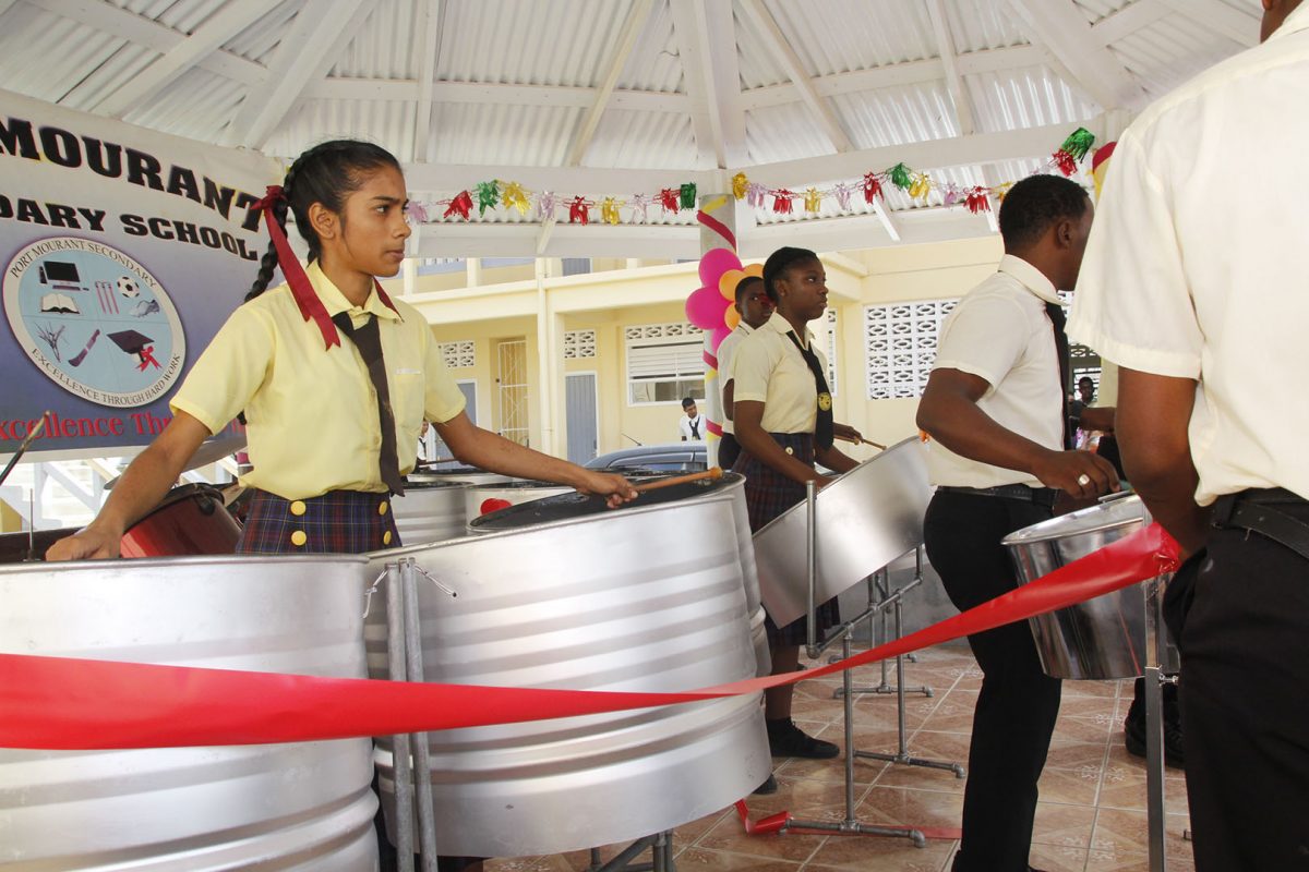 Students of the Port Mourant Secondary School playing their new steelpans (Ministry of Education photo)
