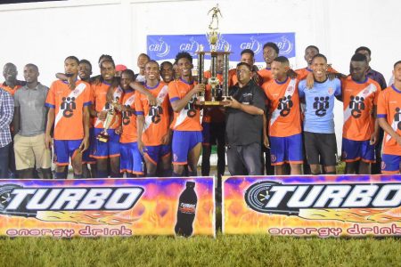 The victorious Fruta Conquerors U20 side in  celebratory mode after defeating GFC to clinch the Turbo Energy Drink knockout football competition.
