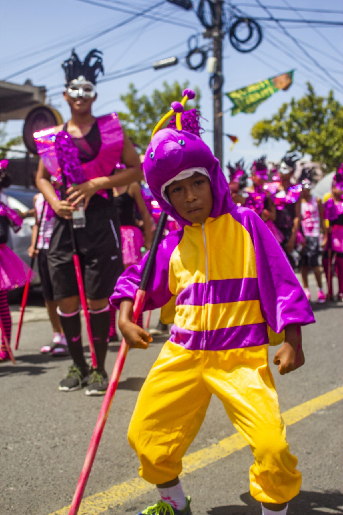 A young reveller ‘Mashin’ down’ the road yesterday during the Children’s Mashramani Costume and Float Parade, which was held in Georgetown. See story and photos inside. (Photo by Rae Wiltshire)