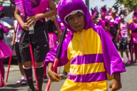 A young reveller ‘Mashin’ down’ the road yesterday during the Children’s Mashramani Costume and Float Parade, which was held in Georgetown. See story and photos inside. (Photo by Rae Wiltshire)
