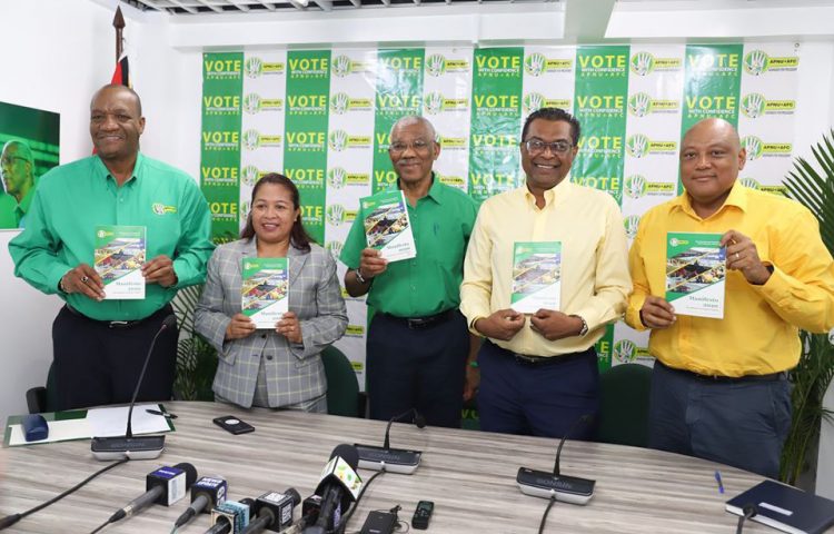 President David Granger (at centre) with running mate Khemraj Ramjattan (second, from right) and other APNU+AFC officials at the launch of the incumbent coalition’s manifesto yesterday (Department of Public Information photo)