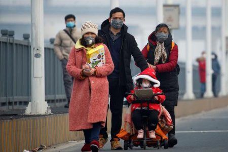 People arrive from the Hubei province at a checkpoint at the Jiujiang Yangtze River Bridge in Jiujiang, Jiangxi province, China, as the country is hit by an outbreak of a new coronavirus, yesterday. (REUTERS/Thomas Peter)