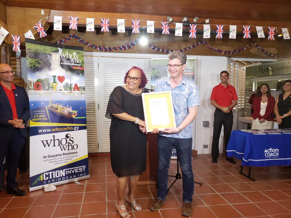 Desiree Edghill receiving the Commonwealth Points of Light Award from British High commissioner, Greg Quinn last evening