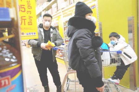 Customers wearing face masks shop inside a supermarket, as the country is hit by an outbreak of the novel coronavirus, in Beijing, China yesterday. (REUTERS/Stringer)
