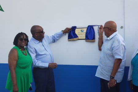 Director General of Ministry of the Presidency Joseph Harmon and Managing Director of GWI Dr Richard Van West-Charles unveiling the plaque at the commissioning of the Uitvlugt water treatment plant