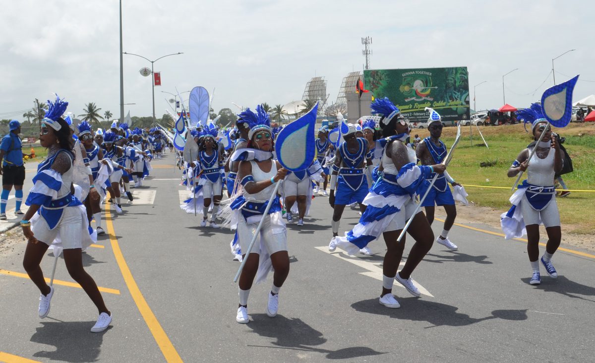 An energetic bunch of revellers from GWI waving their drops of water as they made their way down to D’Urban Park. 