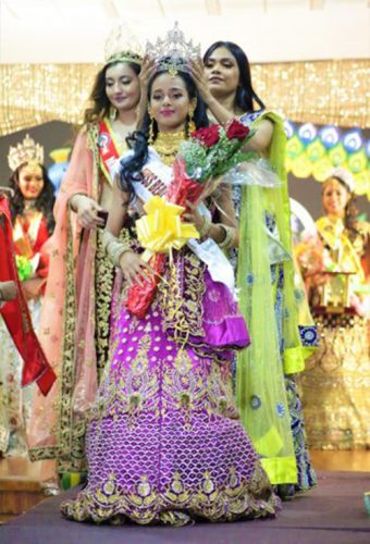 Rashena Hanif being crowned Miss India Guyana 2019 by previous queen Shoshanna Ramdeen.