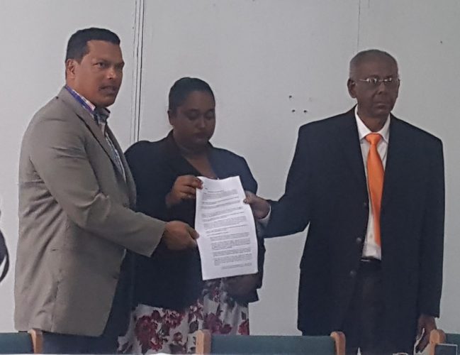 From left are Liberty and Justice Party (LJP) leader and presidential candidate Lenox Schuman, The New Movement (TNM) presidential candidate Dr Asha Kissoon and ANUG presidential candidate Ralph Ramkarran with the signed agreement. 