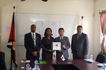 From left are Director of the International Cooperation Department at the Ministry of Foreign Affairs Forbes July, CEO of VYC Goldie Scott, Ambassador Tatsuo Hirayama and Honorary Consul General for Japan in Guyana Kashir Khan after the signing on Friday