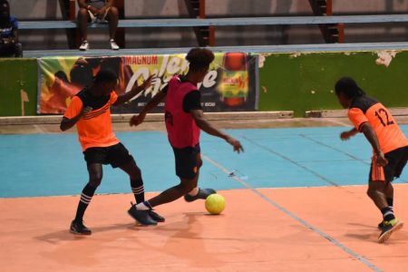 A scene from the second quarterfinal between Sophia and Bent Street in the Magnum Tonic Wine Mashramani Cup Futsal Championships at the National Gymnasium on Mandela Avenue.

