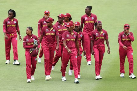 The West Indies women’s team walk off the field after their defeat of Thailand yesterday.