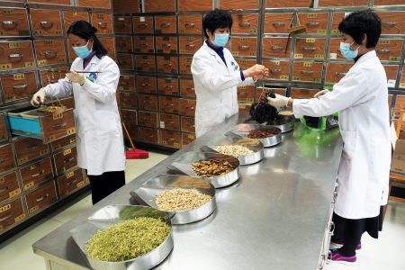 Medical workers prepare traditional Chinese medicine (TCM) at a TCM hospital as the country is hit by an outbreak of the new coronavirus, in Binzhou, Shandong province, China February 5, 2020. Picture taken February 5, 2020. cnsphoto via REUTERS