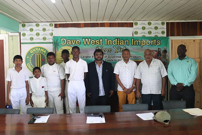 In the presence of some under-15 players, from extreme right, Territorial Development Officer Colin Stuart, Acting President of the GCB Fizaul Bacchus, Owner of Dave’s West Indian Import Dave Narine and GCB Secretary, Anand Sanasie (Romario Samaroo photo).