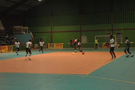 Scenes from the hard-fought clash between Leopold Street (black) and Rio All-Stars (white) at National Gymnasium in the Magnum Tonic Wine Mashramani Cup Futsal 