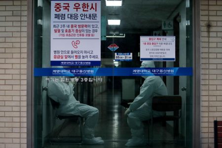 Medical workers stand by at a hospital in Daegu, South Korea, February 23, 2020. Yonhap via REUTERS