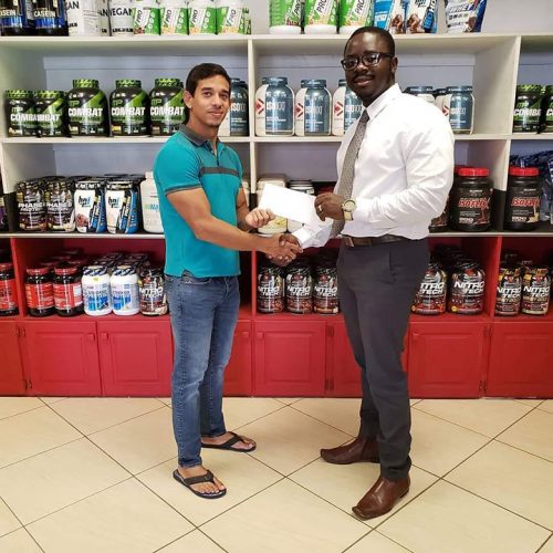 President of the GBBFFI, Keavon Bess (right) receiving the sponsorship cheque from Fitness Express’ CEO, Jamie McDonald recently at the company’s store at 47 John and Sheriff Streets.
