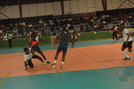 Scenes from the Rio All-Stars [white] and Leopold Street semi-final showdown at the National Gymnasium on Mandela Avenue in the third annual Magnum Tonic Wine Mashramani Futsal Championships.