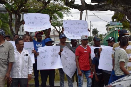 Sugar workers protesting outside the Ministry of the Presidency today. (GAWU photo)