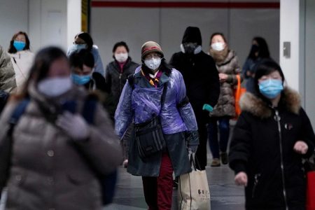 People wearing face masks walk inside a subway station, as the country is hit by an outbreak of the novel coronavirus, in Shanghai, China February 17, 2020. REUTERS/Aly Song