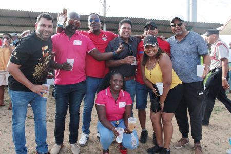Oropuche East MP Dr Roodal Moonilal (standing fourth from left) with friends at Calypso Fiesta in Guaracara Park- Point-Pierre, on Saturday.