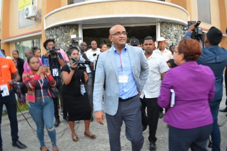 PPP General Secretary Bharrat Jagdeo (right) leaving the Returning Officer’s office at High and Hadfield streets yesterday after the spreadsheet matter was resolved