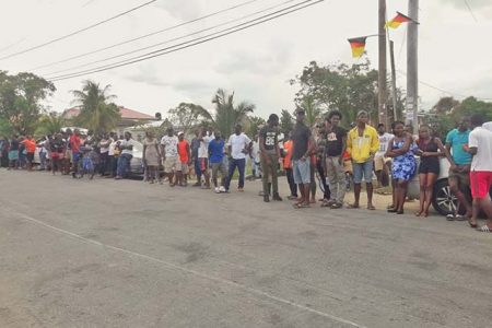 Scores of persons outside of the polling station