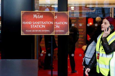 A hand sanitisation station sign is seen at the venue of the planned European premiere for the film Mulan, in Britain on Thursday. (REUTERS/Henry Nicholls photo)
