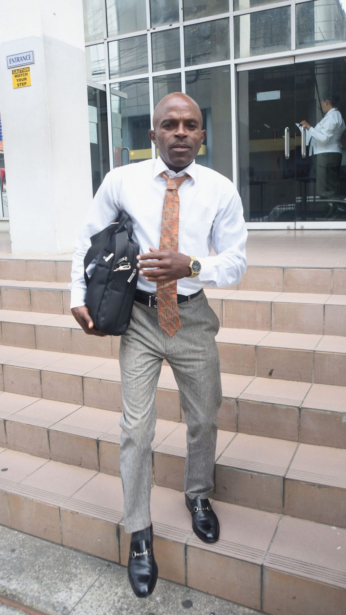 Community activist Anderson Wilson leaves the Port-of-Spain Magistrates Court yesterday after securing a $10,000 bail following his sentencing on a charge of cursing MP Fitzgerald Hinds in 2018.