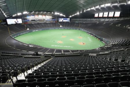 FILE PHOTO: Spectator’s stands are seen empty during the preseason baseball game of Hokkaido Nippon-Ham Fighters and Orix Buffaloes, which is taking place behind closed doors amid the spread of the new coronavirus, at the Sapporo Dome in Sapporo, Hokkaido, Japan February 29, 2020, in this Kyodo photo. Kyodo via REUTERS 