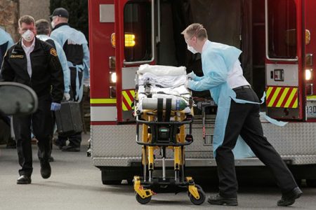 A medic prepares a stretcher to transfer a patient into an ambulance at the Life Care Center of Kirkland, the long-term care facility linked to several confirmed coronavirus cases in the state, in Kirkland, Washington, U.S. March 5, 2020. REUTERS/David Ryder