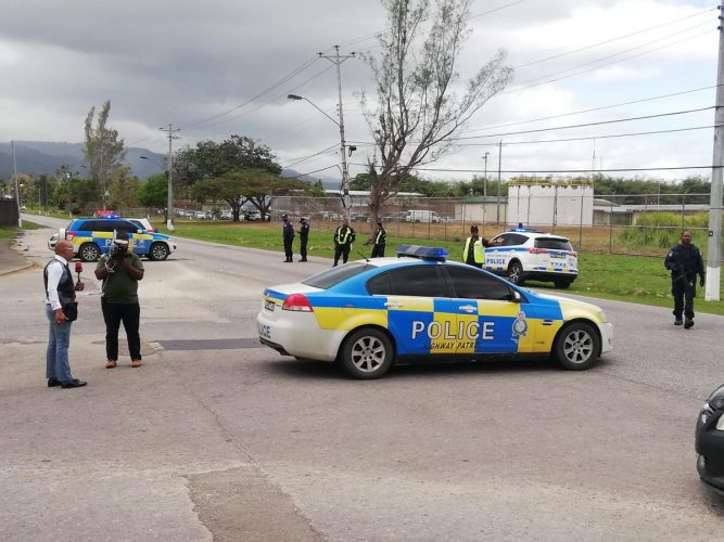 A police vehicle is seen at the entrance to the Golden Grove Prison in Arouca, which is currently lock down in attempts to stop prisoners from escaping, as they  claim they are fearful of contracting the COVID-19 coronavirus. -Photo: JERMAINE CRUICKSHANK 