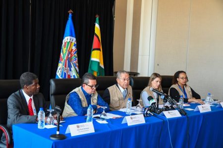 OAS Electoral Observer Mission. Chief of Mission, Bruce Golding, sits third from left during a recent briefing. (Department of Public Information photo)