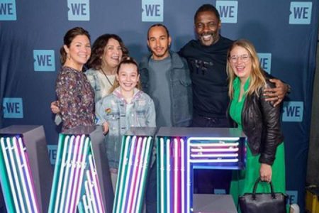 Lewis Hamilton, centre, attended a WE Movement event earlier this month.
