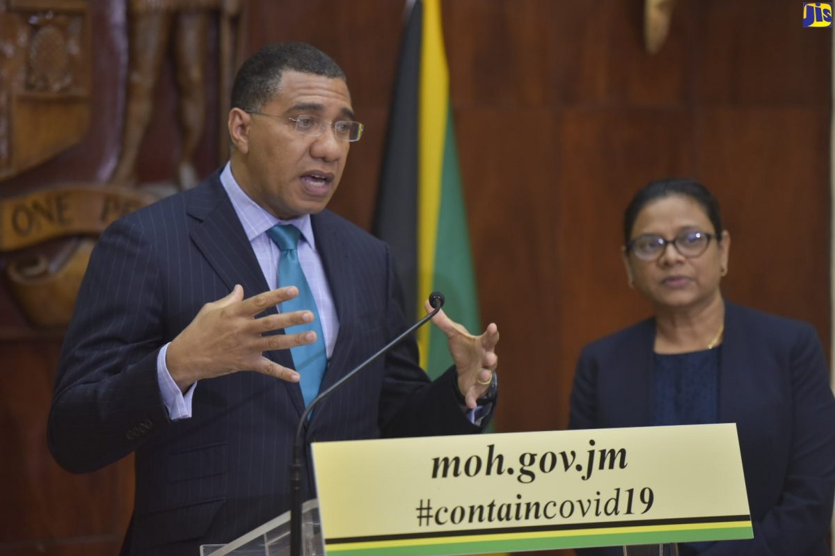 Prime Minister, the Most Hon. Andrew Holness (left), speaks at a press conference at Jamaica House