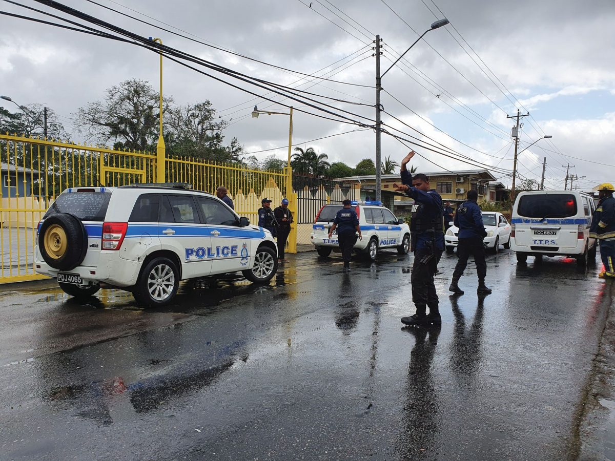 Police officers direct traffic around their convoy outside the Bethel ‘The House of God’ church in Freeport yesterday. The church has been in the news recently for holding services despite the call that such social gatherings should be stopped due to the COVID-19 virus.