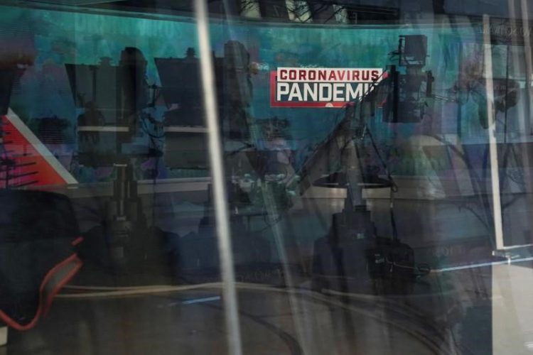 A "Coronavirus Pandemic" sign is pictured though a window at a closed NBC news studio following the outbreak of coronavirus disease (COVID-19), in the Manhattan borough of New York City, New York, U.S., March 24, 2020. REUTERS/Carlo Allegri
