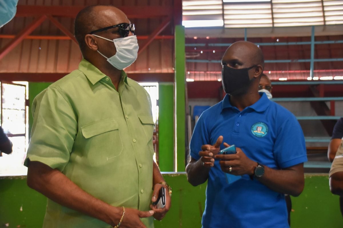 New Chief Executive Officer (CEO) of the National COVID-19 Task Force (NCTF) Secretariat Joseph Harmon being briefed by Director General of the Civil Defence Commission (CDC) Kelvin Craig during a site visit to the National Gymnasium yesterday afternoon.  