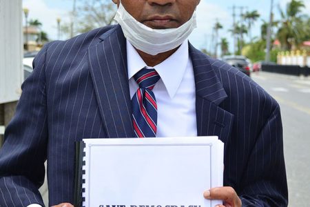 Randy Depoo yesterday displaying a booklet consisting of the 6,500 signatures he has gathered thus far.
