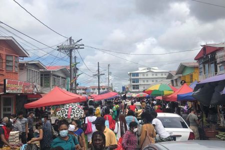 Robb Street, between Alexander and Bourda streets, crowded with shoppers yesterday ahead of the planned
closure of the city markets